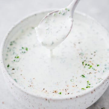 Creamy homemade ranch dressing with fresh herbs served in a small bowl.