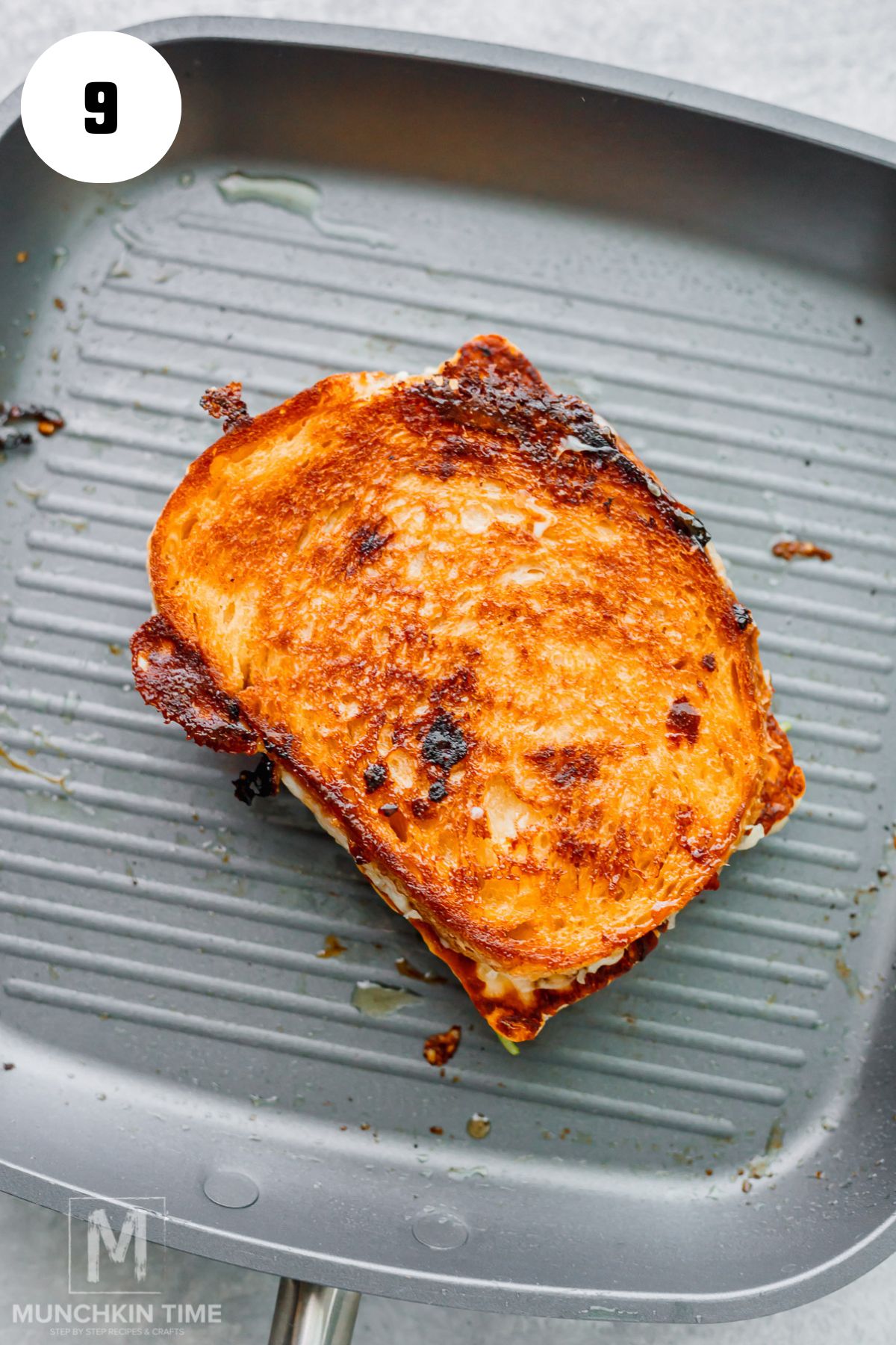 Golden brown halloumi grilled cheese sandwich cooking on the second side.