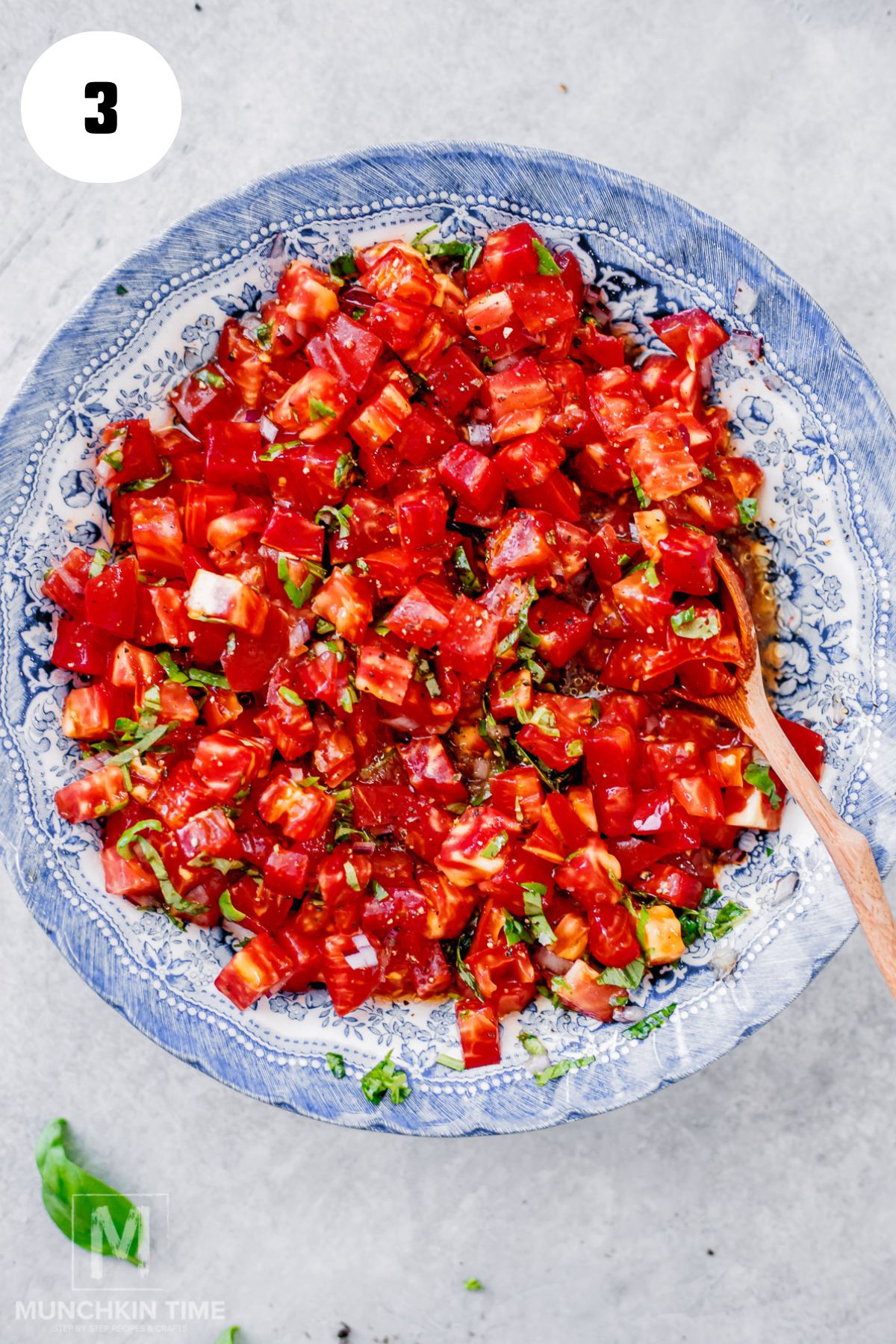 Tomato basil bruschetta topping mixed together in a bowl.