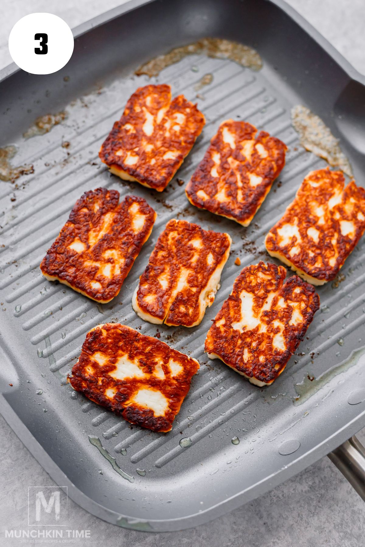 Golden brown pan-fried halloumi cheese for grilled cheese sandwich.