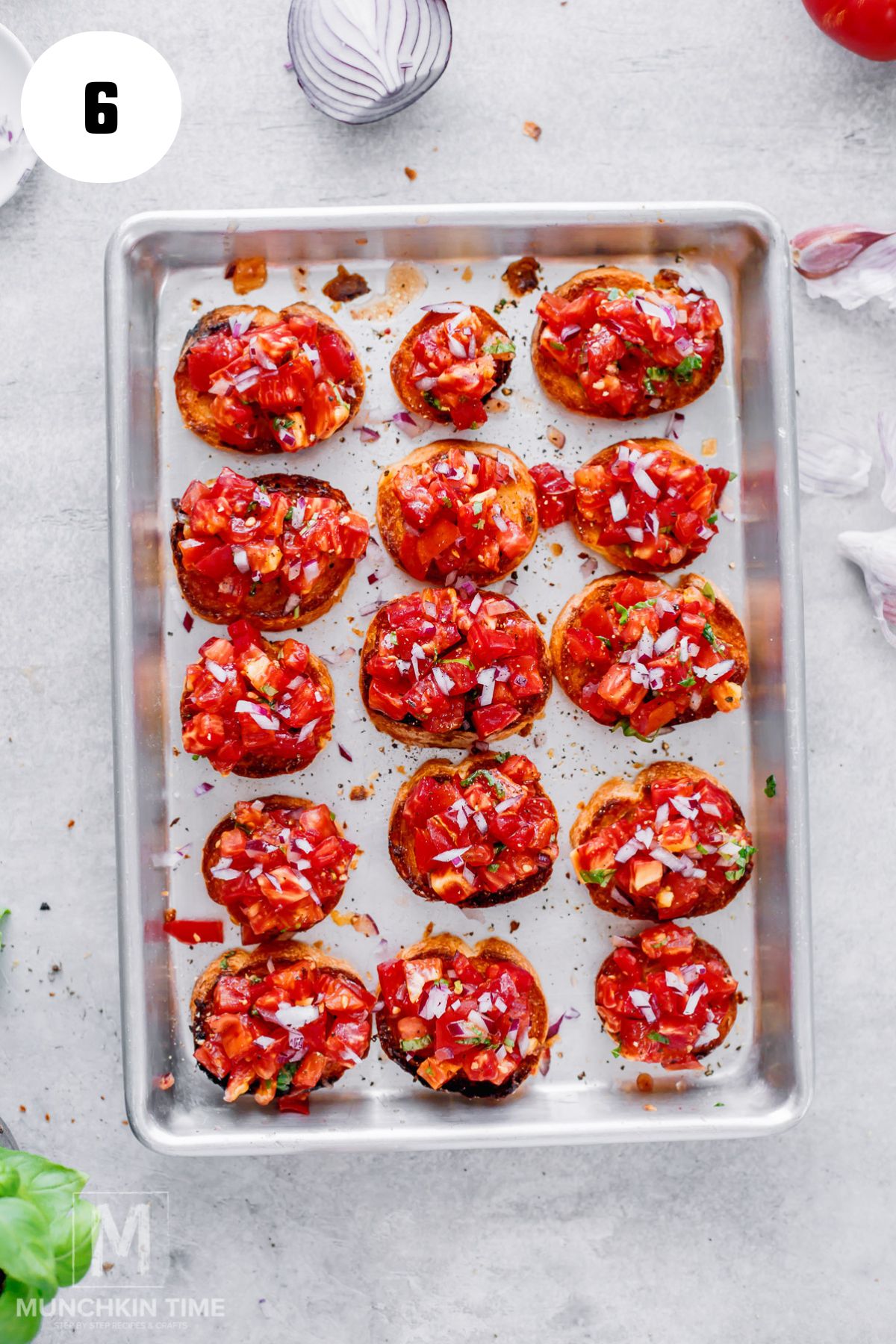 Heirloom tomato bruschetta topping spooned onto toasted bread.