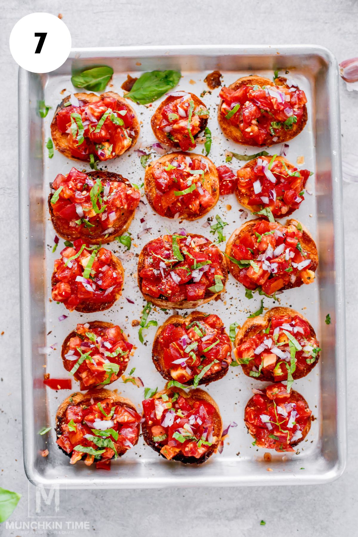 Fresh heirloom tomato bruschetta topped with basil and ready to serve.
