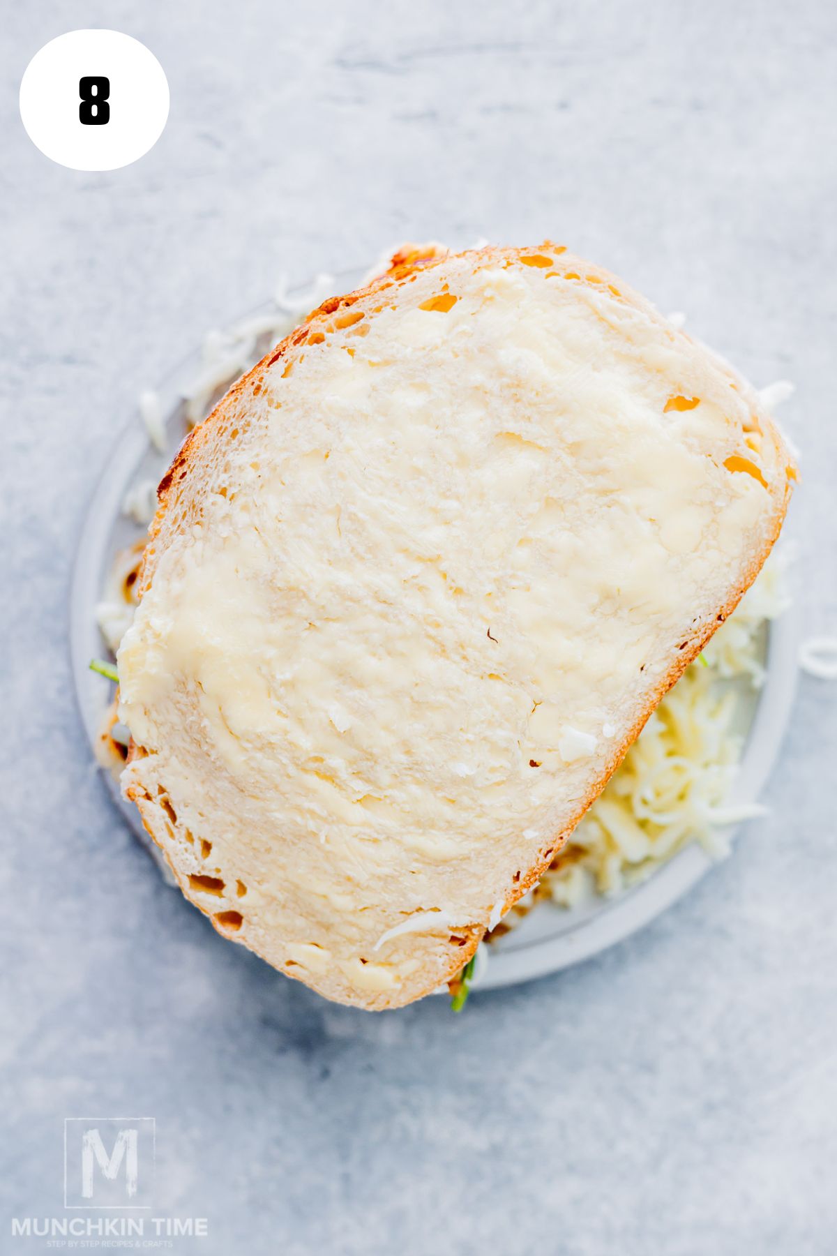 Place the second slice of sourdough on top and gently press the sandwich together.