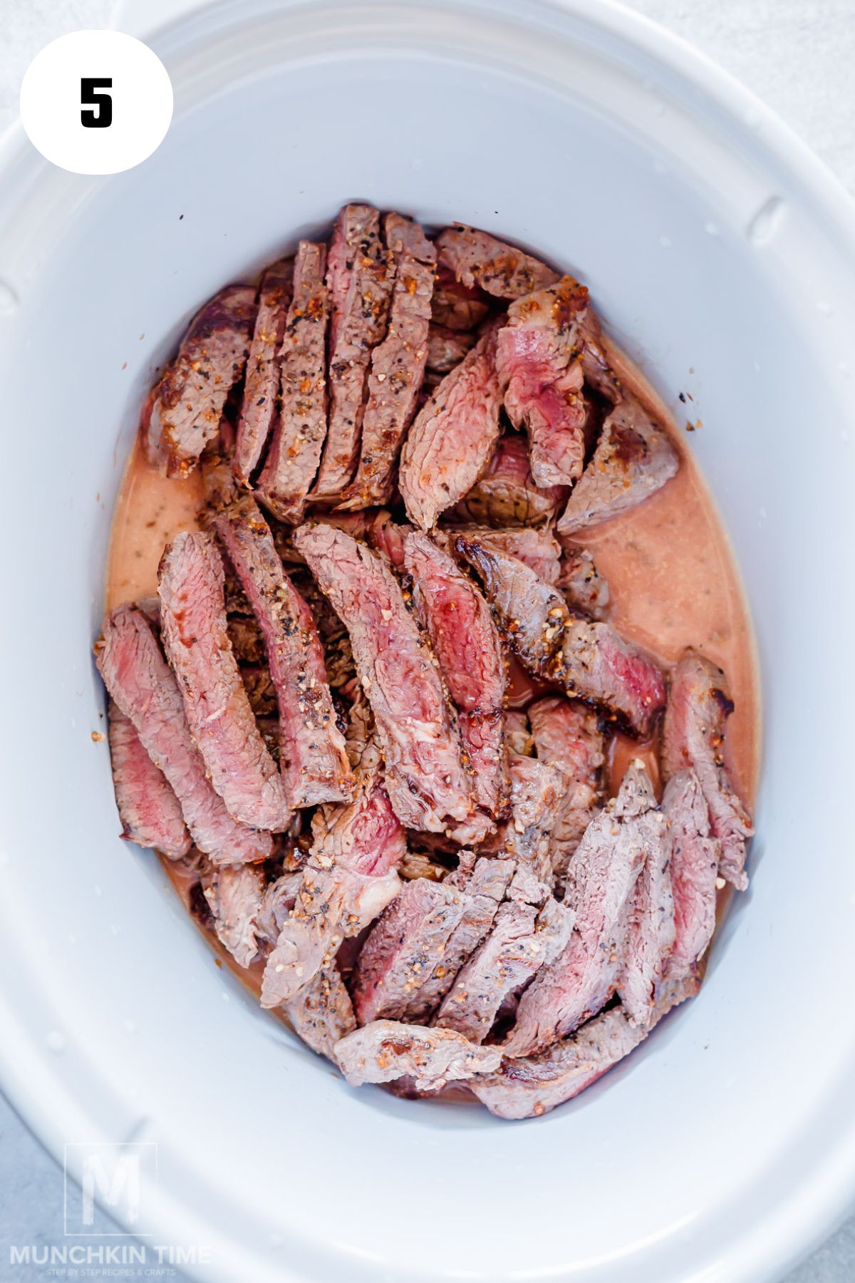 browned sliced steak added to the crock pot.