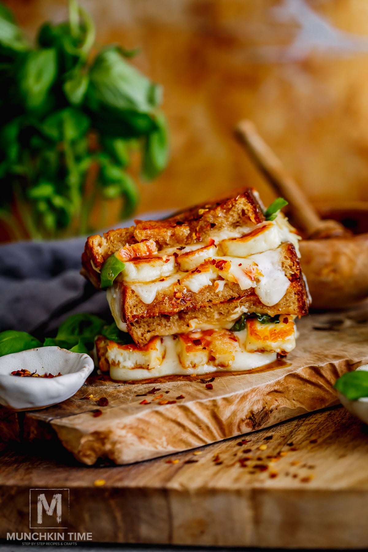 Close-up of hot honey halloumi grilled cheese with melted mozzarella.