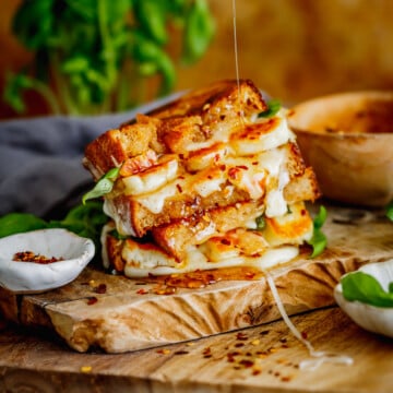 That crispy sourdough, salty golden halloumi, gooey mozzarella, and drizzle of hot honey make every bite of this grilled cheese completely irresistible.