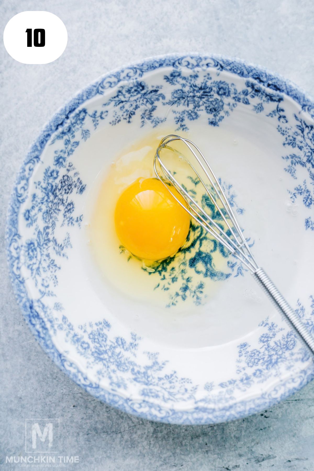 Whisking egg and water to make egg wash for pumpkin hand pies.