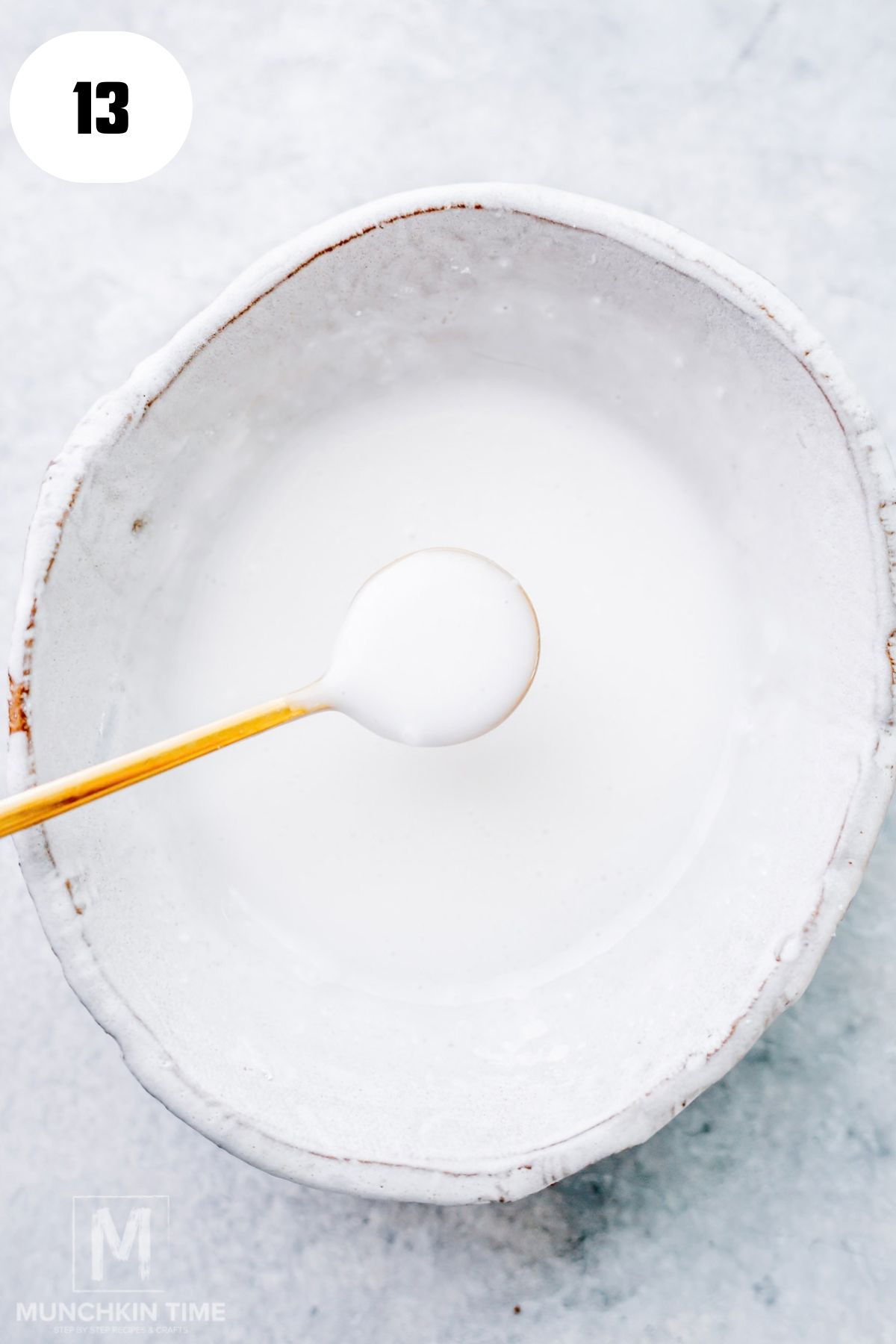 Simple powdered sugar glaze being whisked in a small bowl.