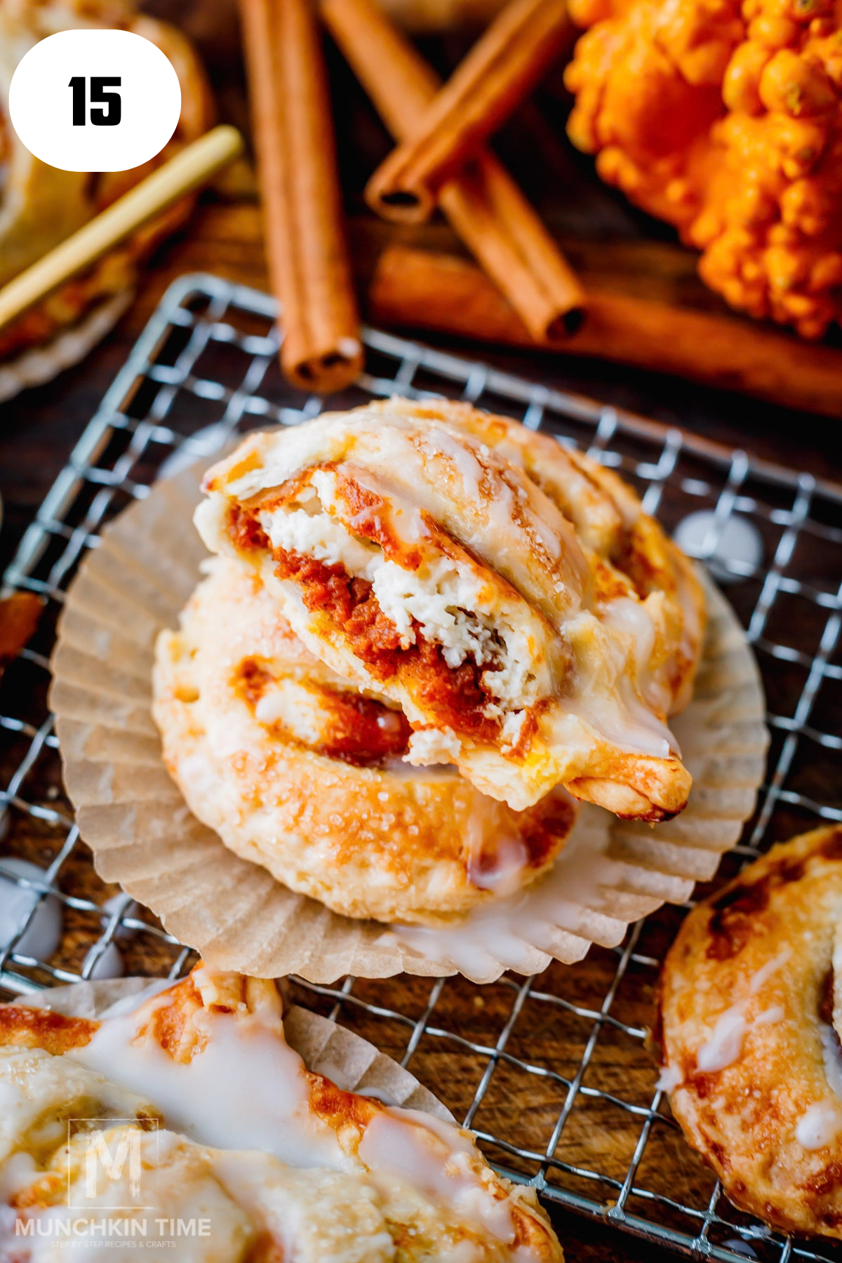 Pumpkin cream cheese hand pie cut open showing creamy pumpkin spice and cream cheese filling.