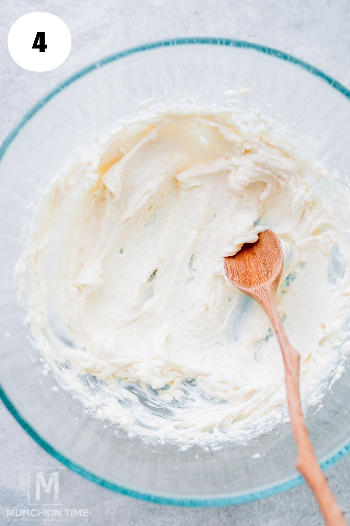 Sweet cream cheese filling mixed with sugar and vanilla in a small bowl.