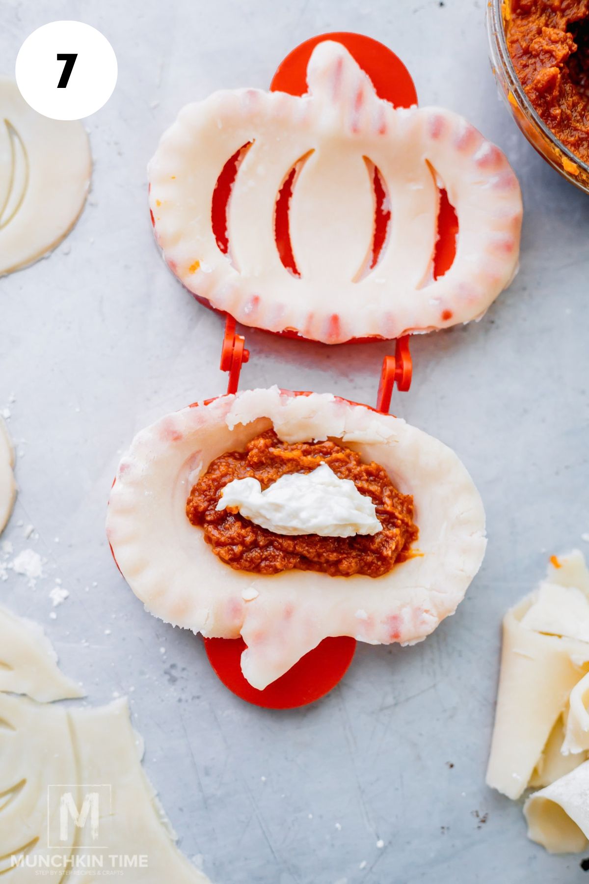 Cream cheese filling added on top of pumpkin filling for pumpkin hand pies.
