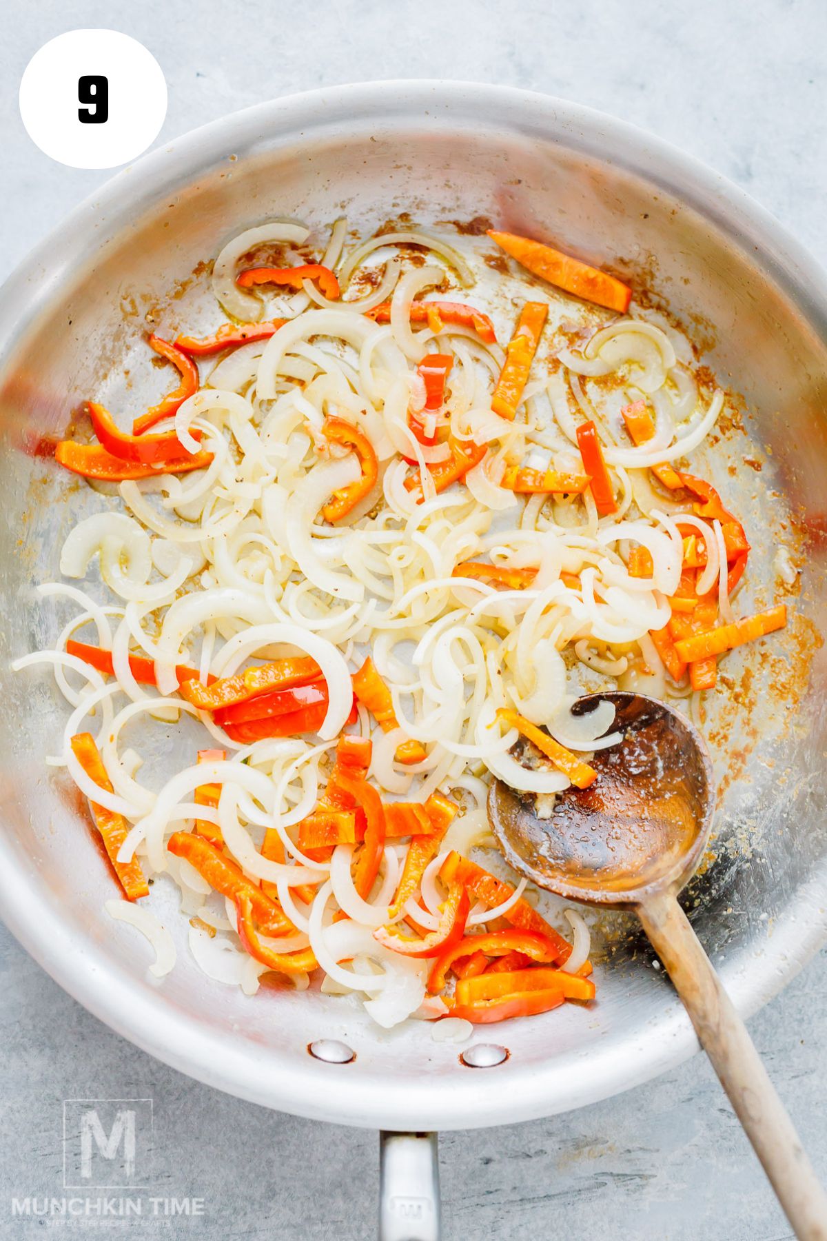 Stir frying onion and bell pepper in a skillet.