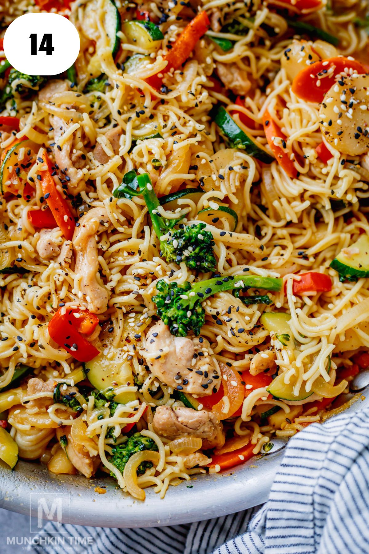 Easy chicken lo mein with chicken, noodles, vegetables, water chestnuts and sesame seeds.