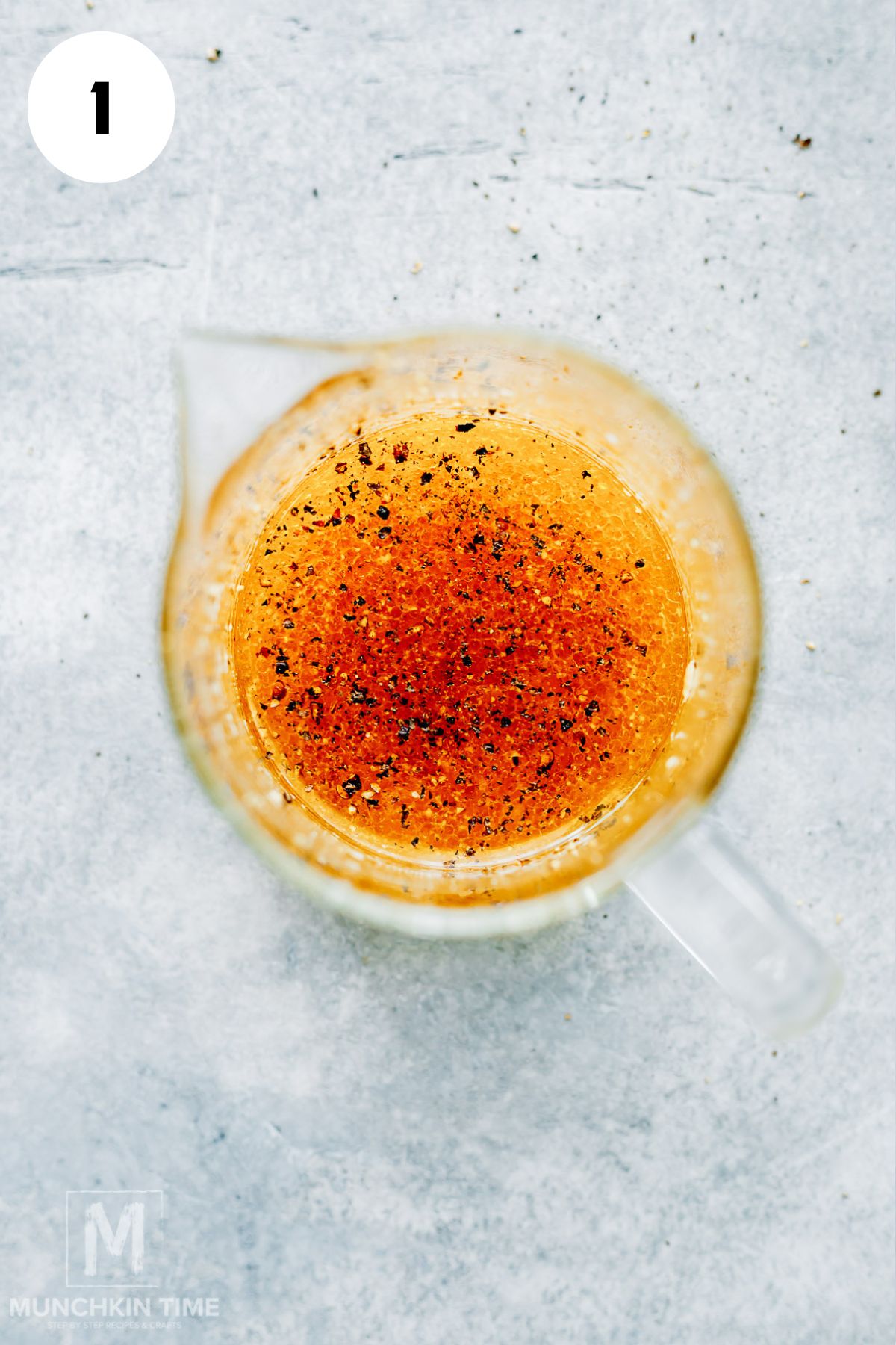 Homemade apple cider vinaigrette with black pepper