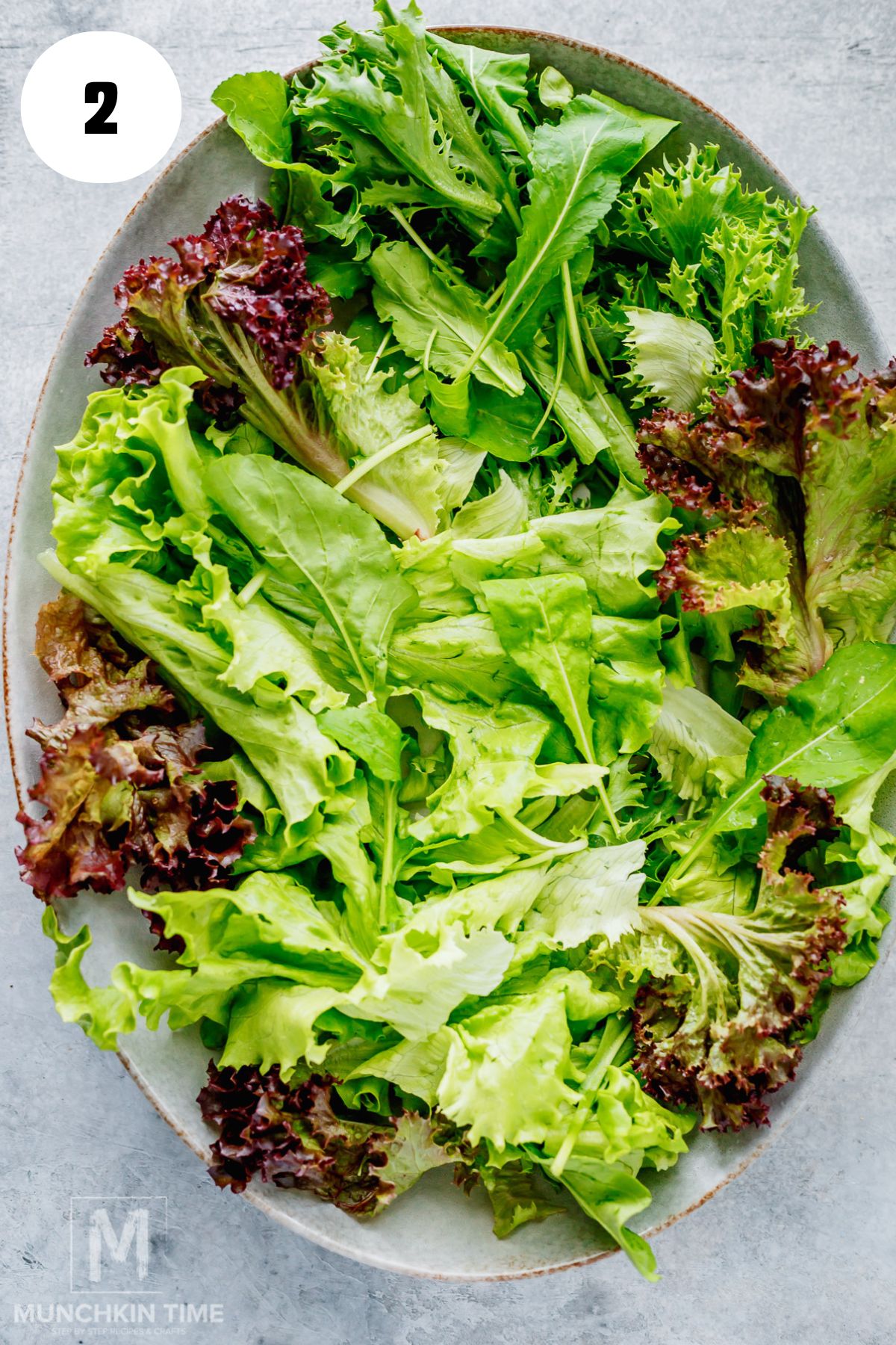 Mixed greens arranged on a platter