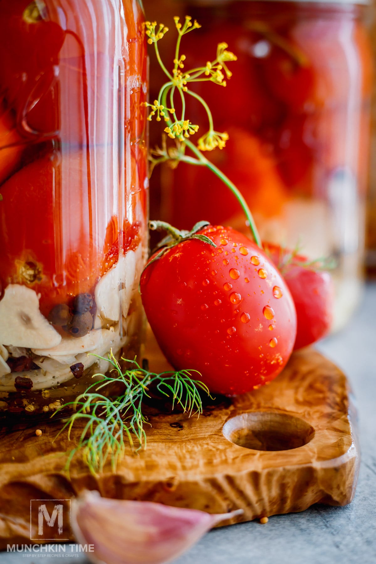 tomatoes jars of homemade pickled Roma tomatoes with garlic dill and onion