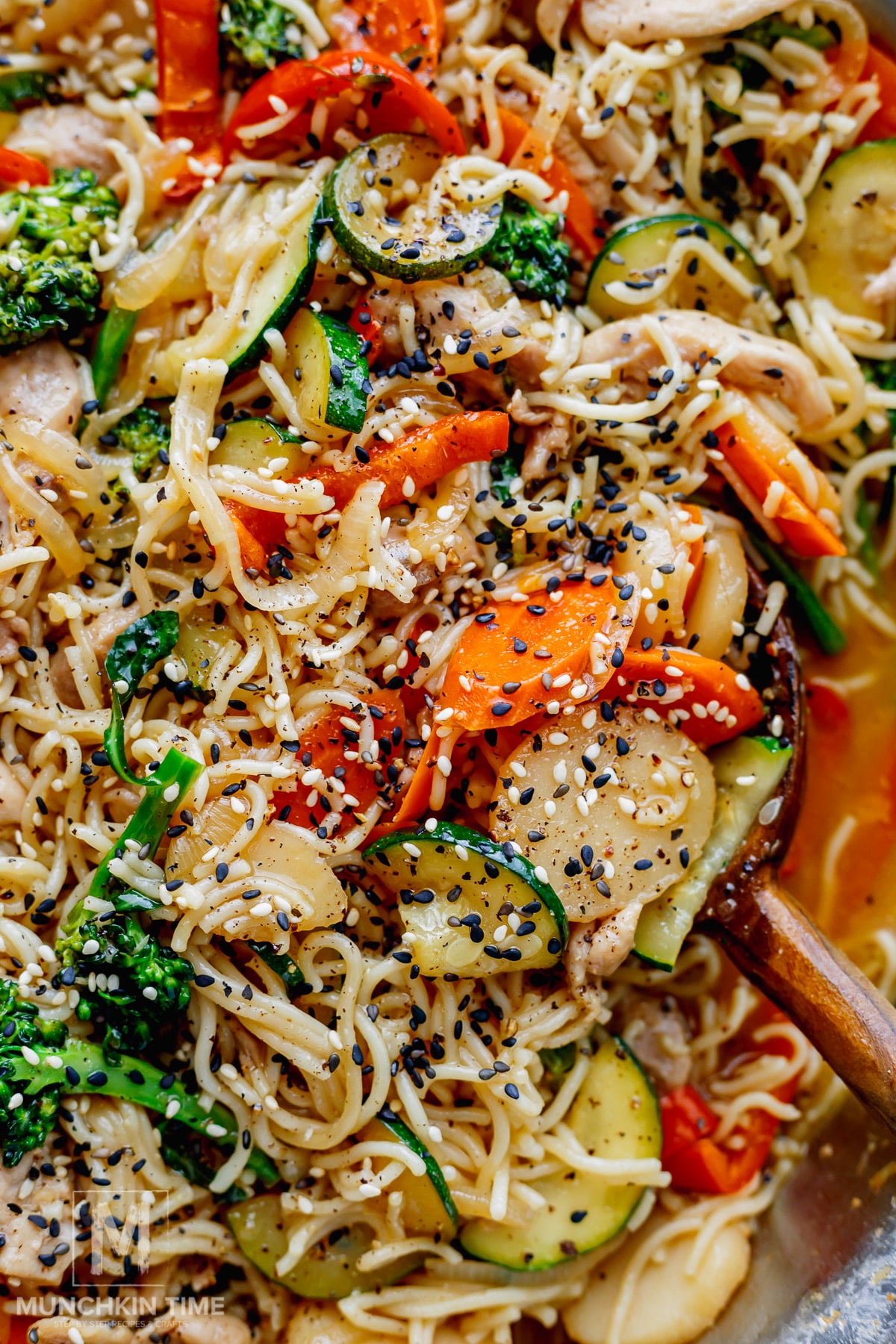 Easy chicken lo mein with noodles, chicken, vegetables and sesame seeds.