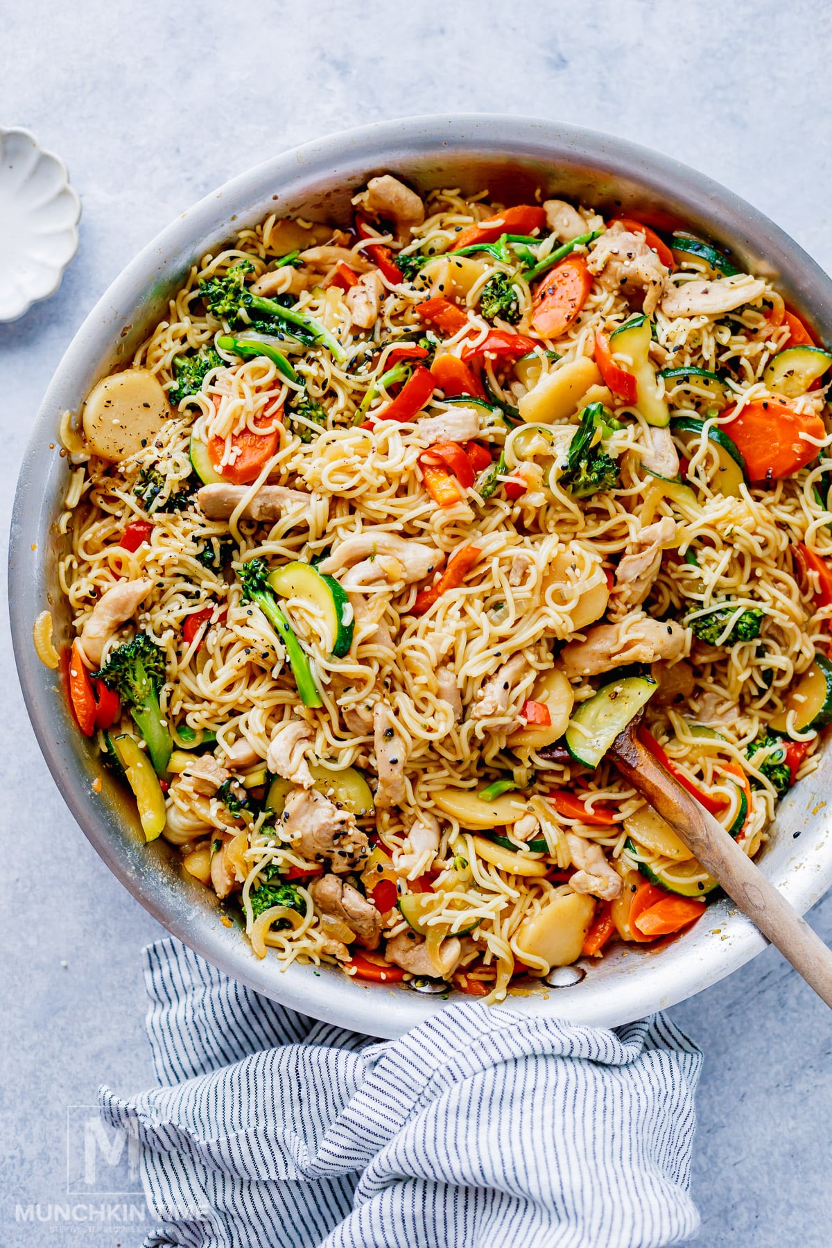 Easy chicken lo mein with noodles, chicken, vegetables and sesame seeds.