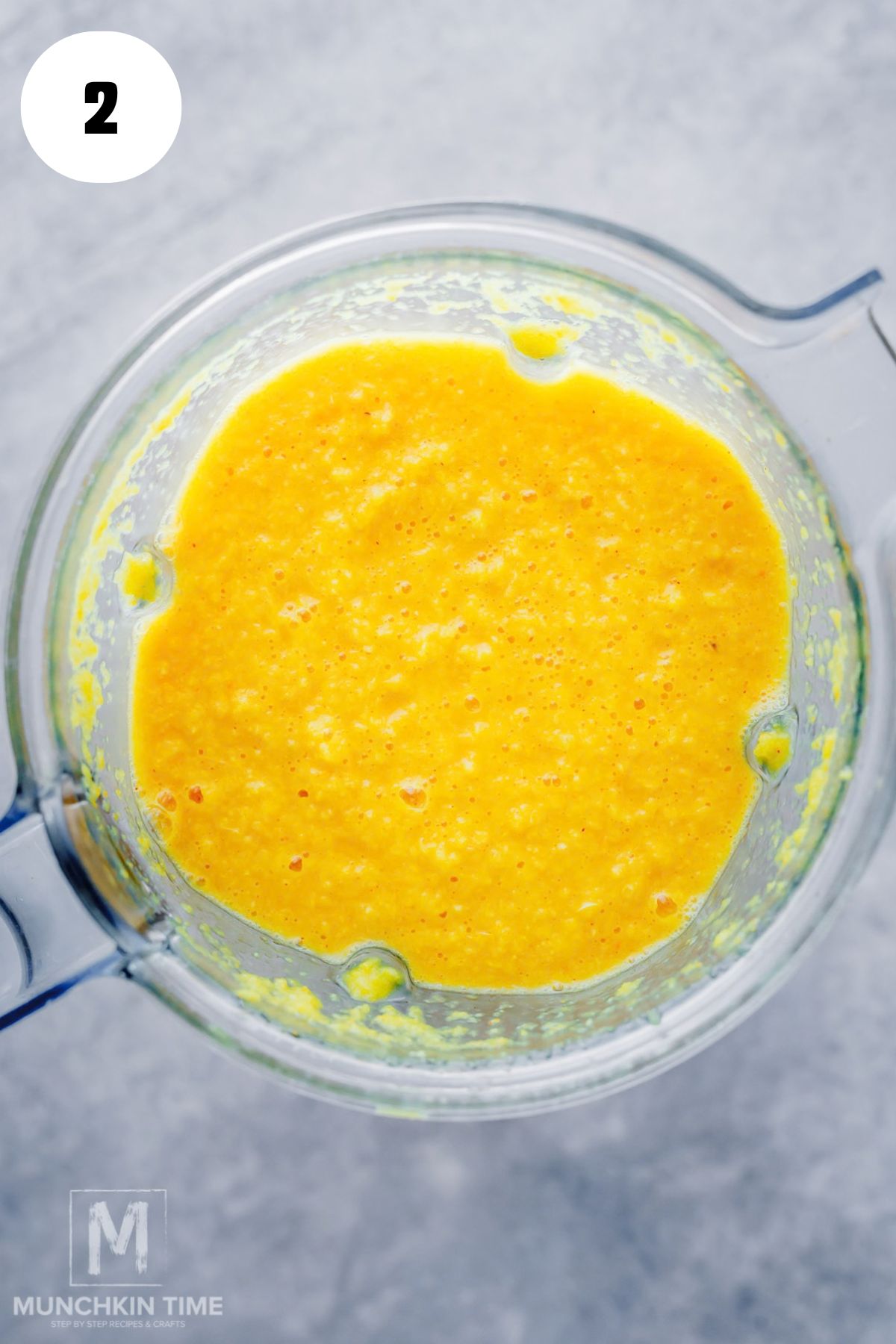 Blending fresh lemon, ginger and turmeric with water
