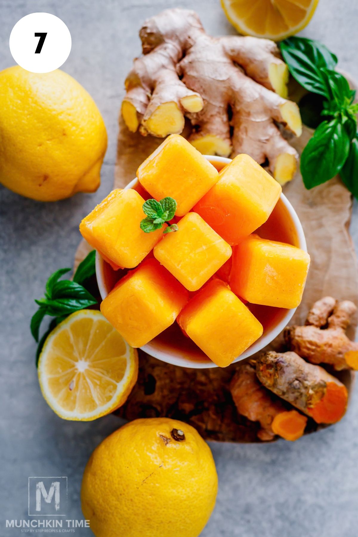 lemon ginger ice cubes in a bowl ready to be used.