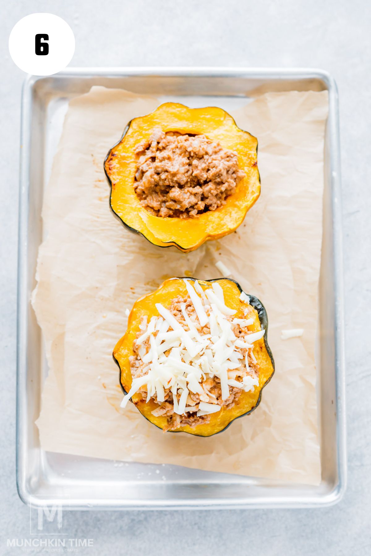 Filling roasted acorn squash halves with cheesy ground beef and refried beans