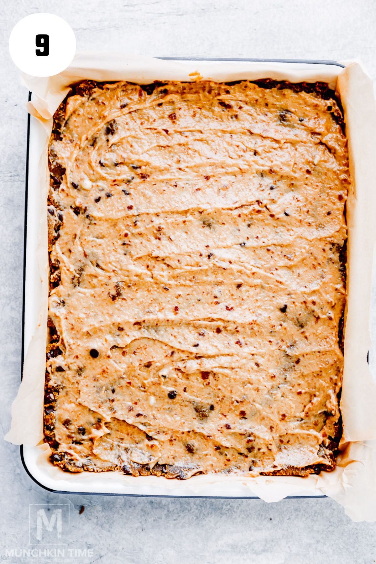 Spreaded creamy date caramel over chilled cookie dough base