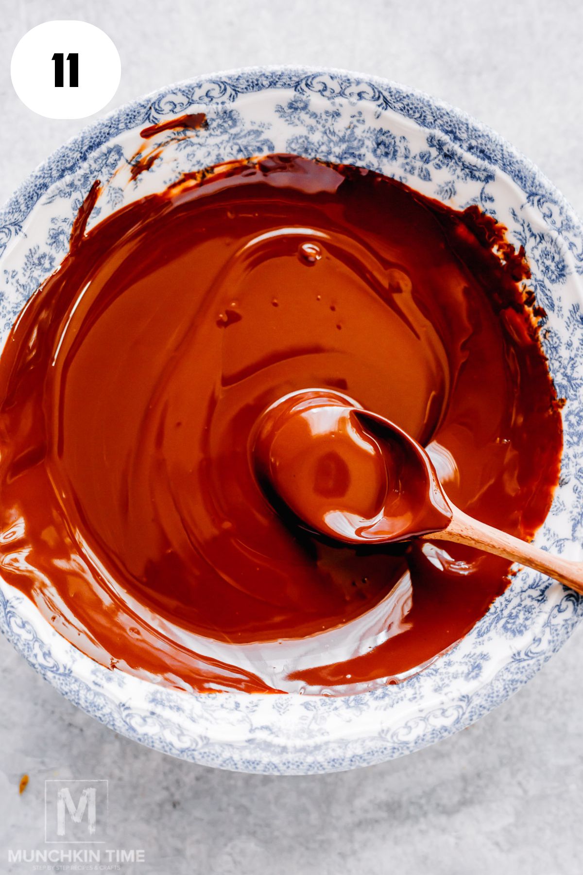 Melted dark chocolate and coconut oil stirred together in a bowl
