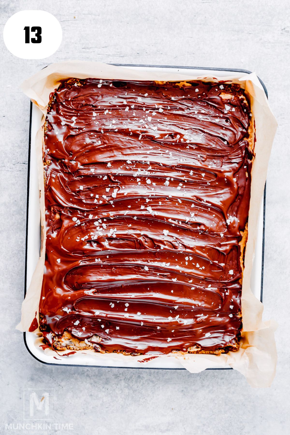 Sprinkling flaky sea salt over the chocolate topping before freezing