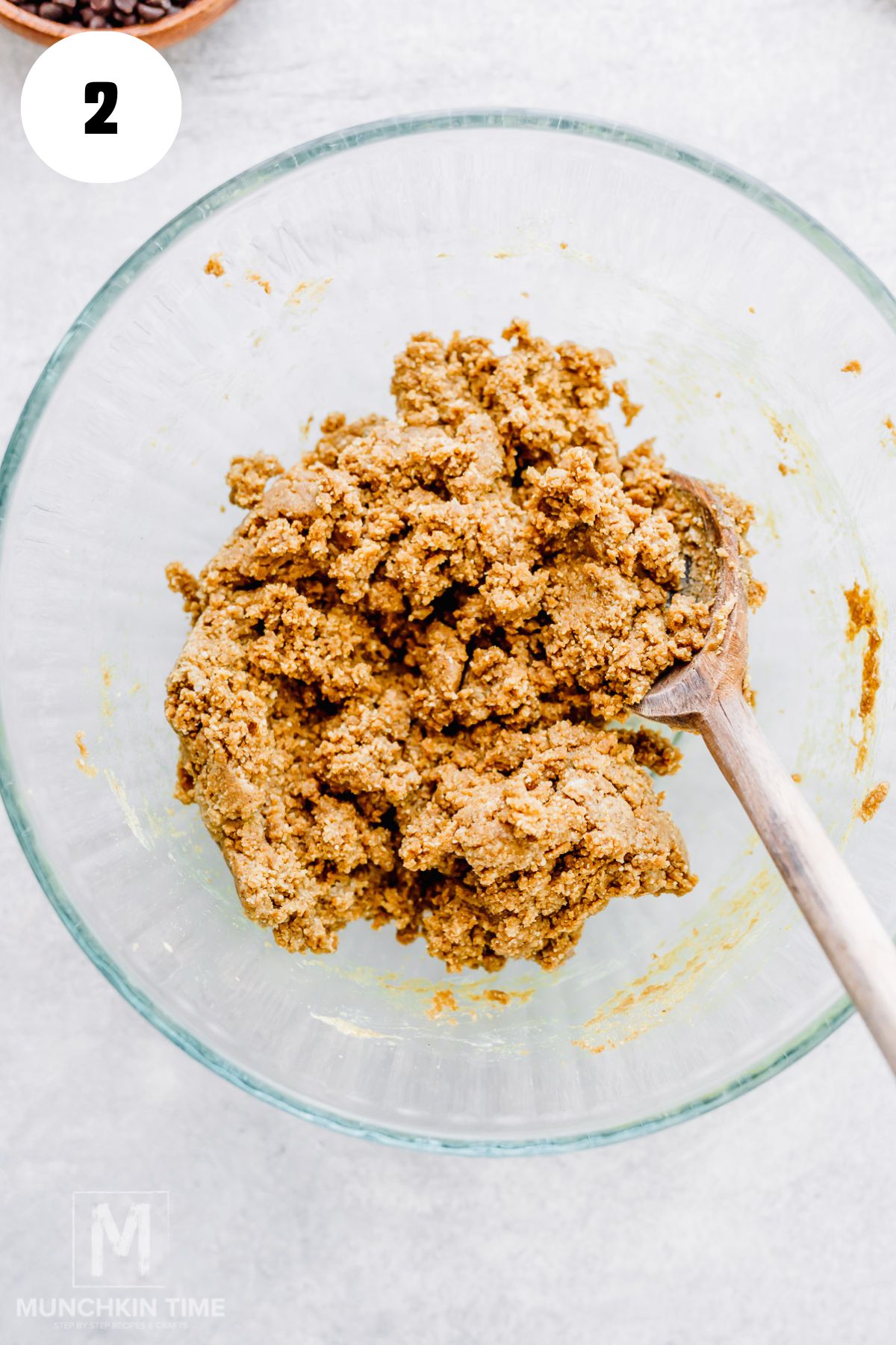 mixed almond flour, protein powder, nut butter, and maple syrup in a bowl