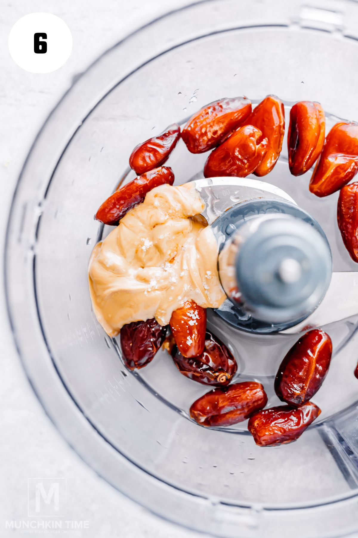 Blending Medjool dates, nut butter, and vanilla into smooth date caramel