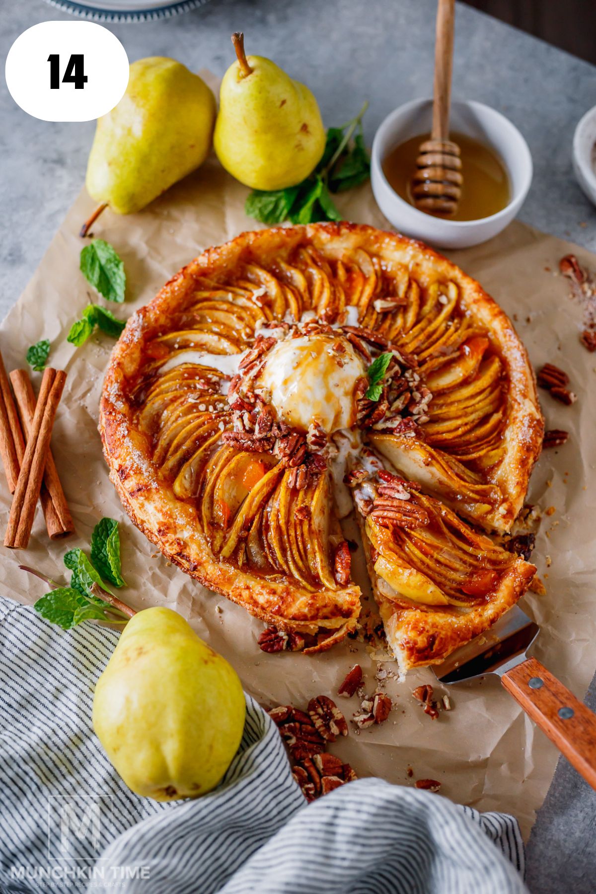 Freshly baked pear galette with golden flaky puff pastry and tender cinnamon pears.
