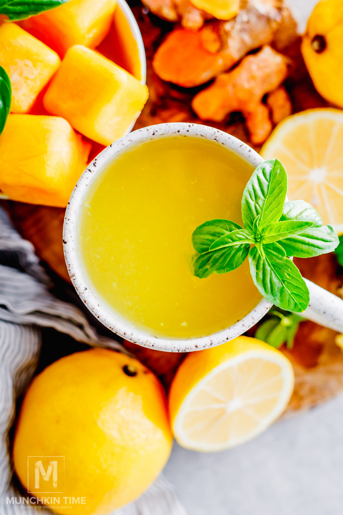 Warm ginger root lemon honey tea made with a frozen pulp cube